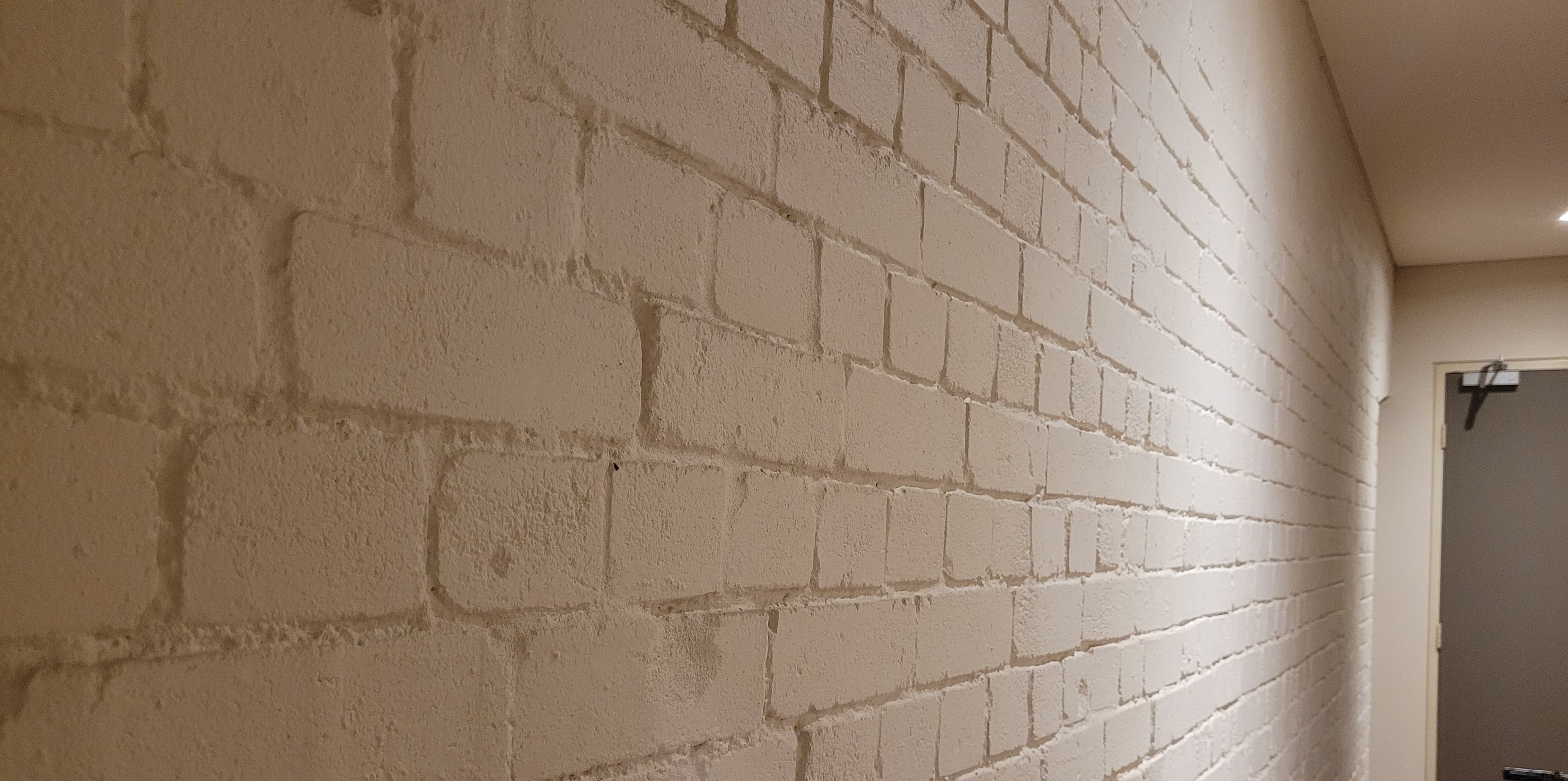 Painted brick interior wall in a home