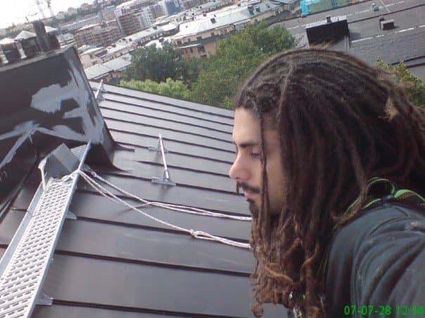 Jacob on scaffolding, working on facade projects