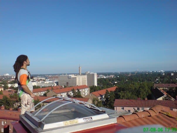 Jacob on a rooftop overlooking the city